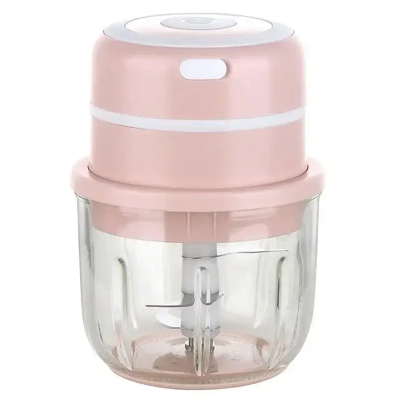 Modern light blue electric food chopper with a pink and white compact design and clear glass bowl for kitchen use