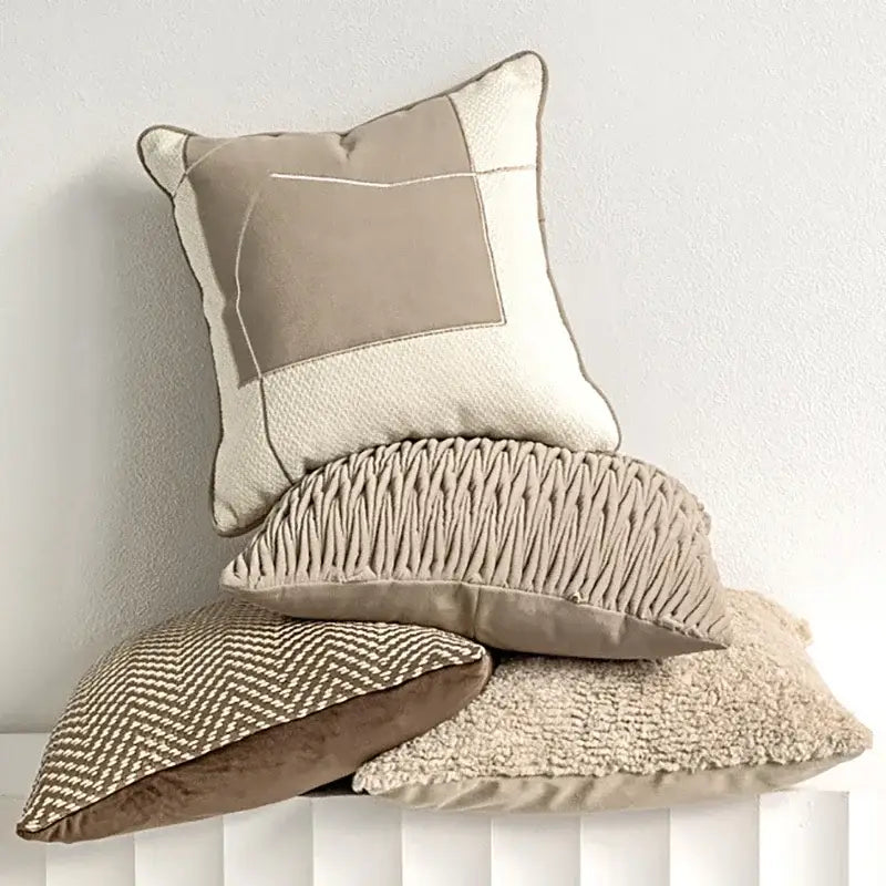 Beige and cream patchwork pillow covers with textured fabric panels for modern light coffee decorbites decor