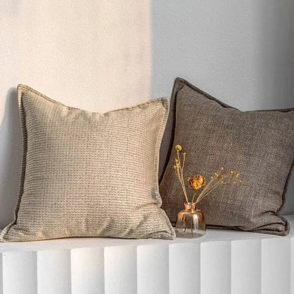 Beige textured linen throw pillow cover with dark brown piping in modern light coffee decorbites light coffee style decor