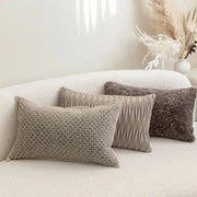Three beige textured throw pillows with knitted and pleated patterns on decorbites light grey coffee cushion covers