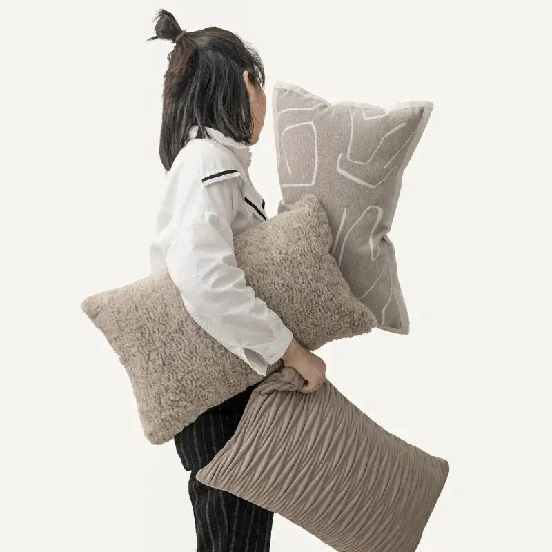 A beige textured throw pillow with a subtle geometric pattern in decorbites light grey coffee cushion covers for living room decor