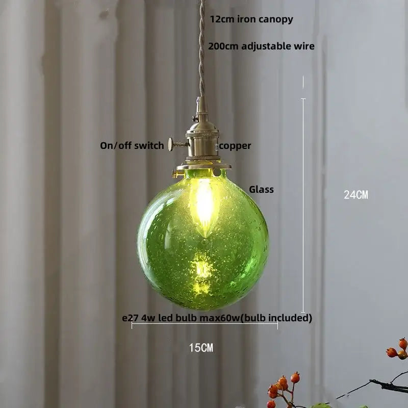 Modern lime green decorbites bubble glass pendant light with copper hardware and adjustable wire suspension for dining room