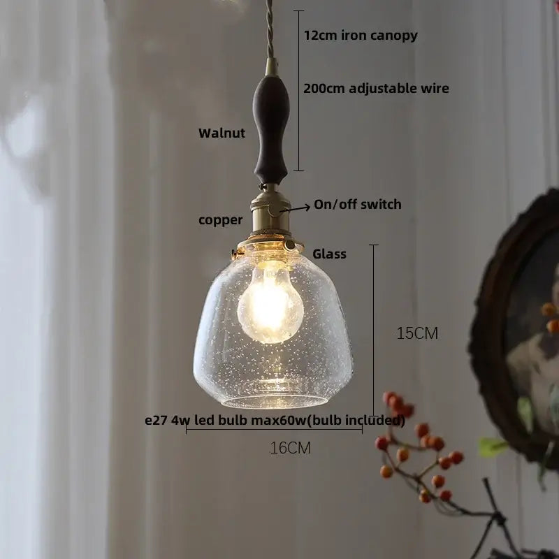 Modern lime and teal blue bubble glass ball pendant light with warm glow iron canopy and walnut handle for dining room decorbites bubble glass