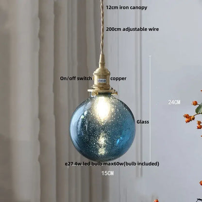 Modern lime and teal bubble glass ball pendant light with blue speckled glass, brass copper switch, and iron canopy