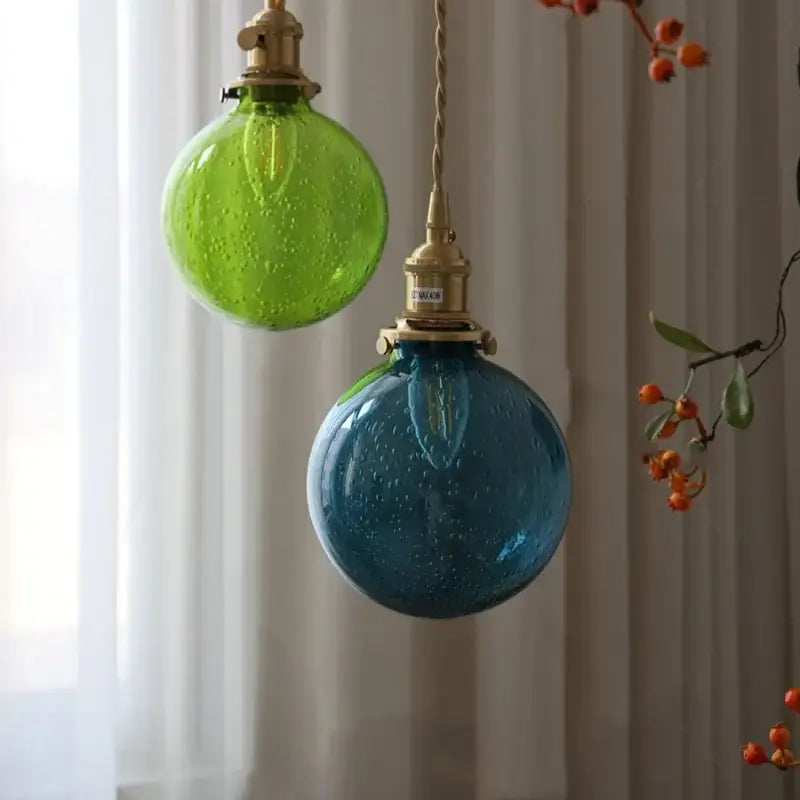 Two spherical pendant lights in lime and teal bubble glass ball with brass fixtures for modern decorbites bubble glass lighting