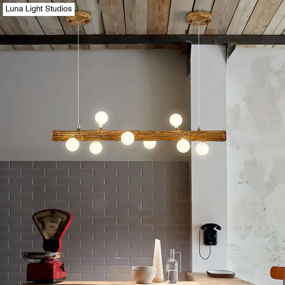 Rustic wooden log pendant light with six warm white globe bulbs modern linear brown metal island lamp by decorbites