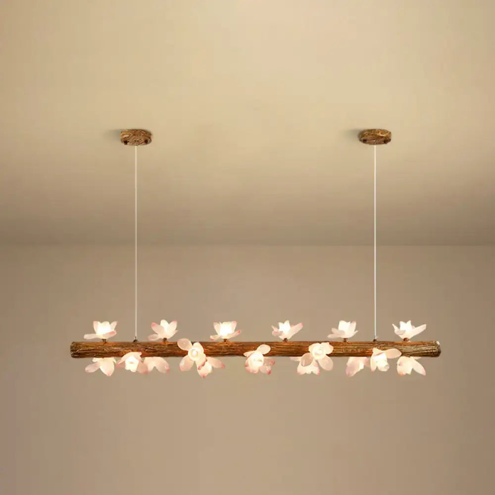 DecorBites™ brown modern linear island pendant metal lamp with a rustic wooden branch and pink flower-shaped lights