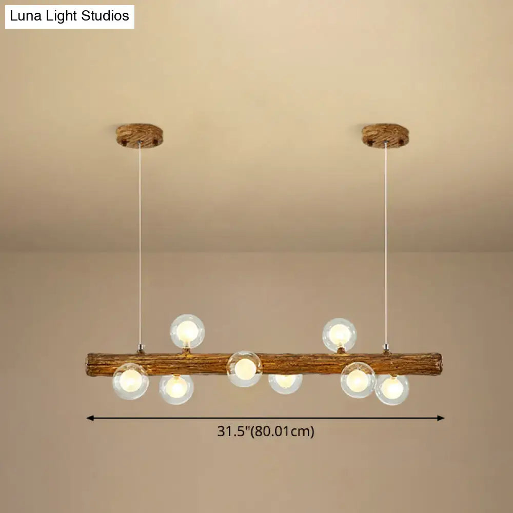 Rustic wooden log pendant light with six clear glass globes in a brown modern linear island metal lamp by decorbites