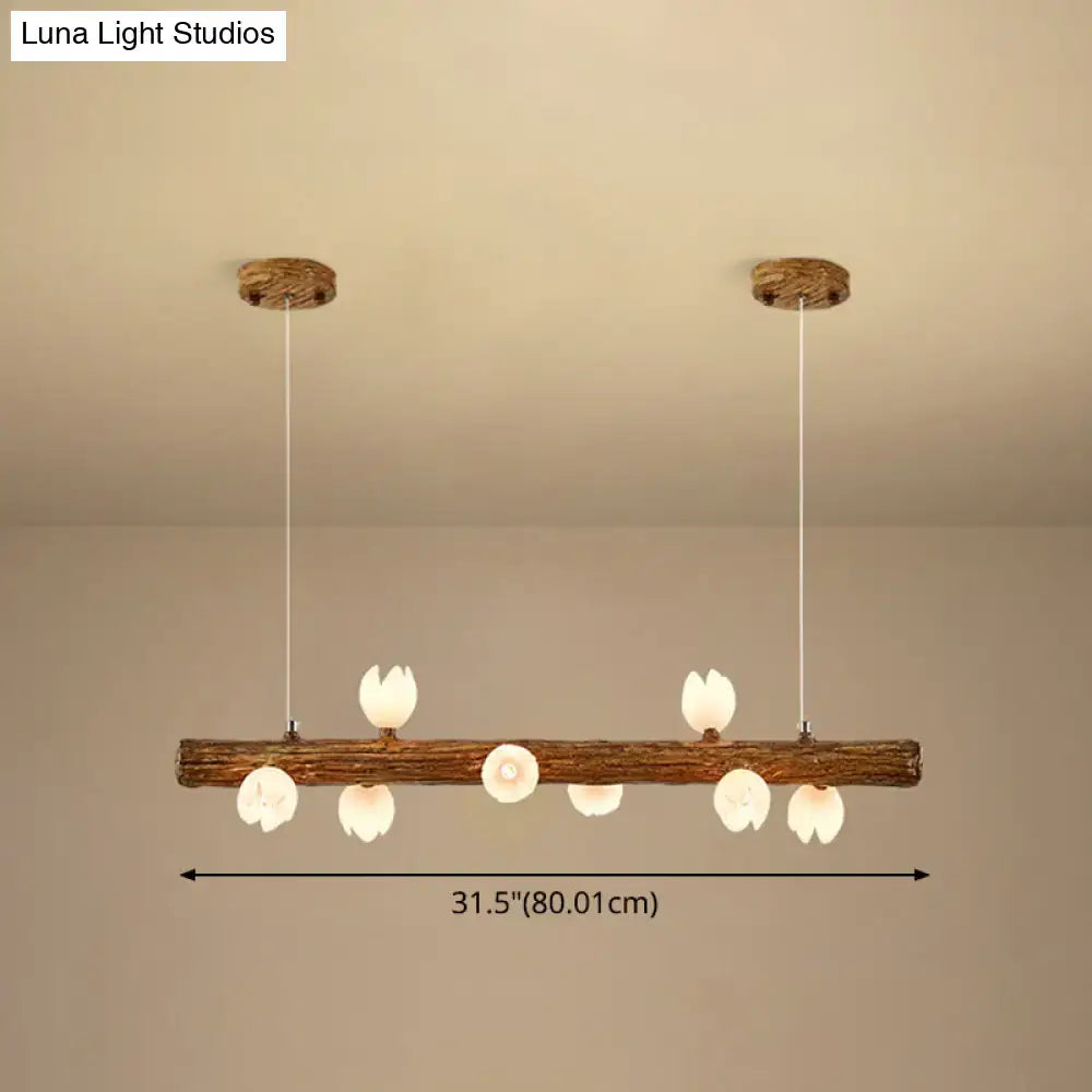 Rustic wooden log pendant light with six white ceramic flower-shaped bulbs in decorbites brown modern linear metal lamp