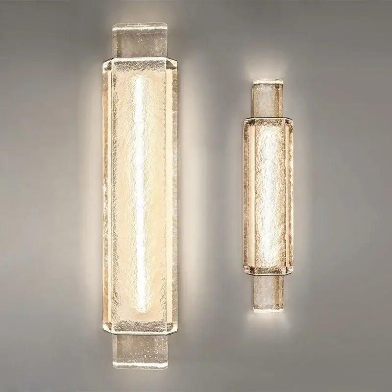 Two modern luxe gold crystal glass wall lamps with textured translucent shades emitting warm glow for bedroom decorbites elegant bubble
