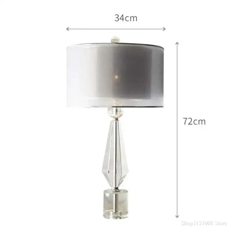 Modern luxe gray and crystal table lamp with faceted crystal base and silver gradient shade for bedroom lighting