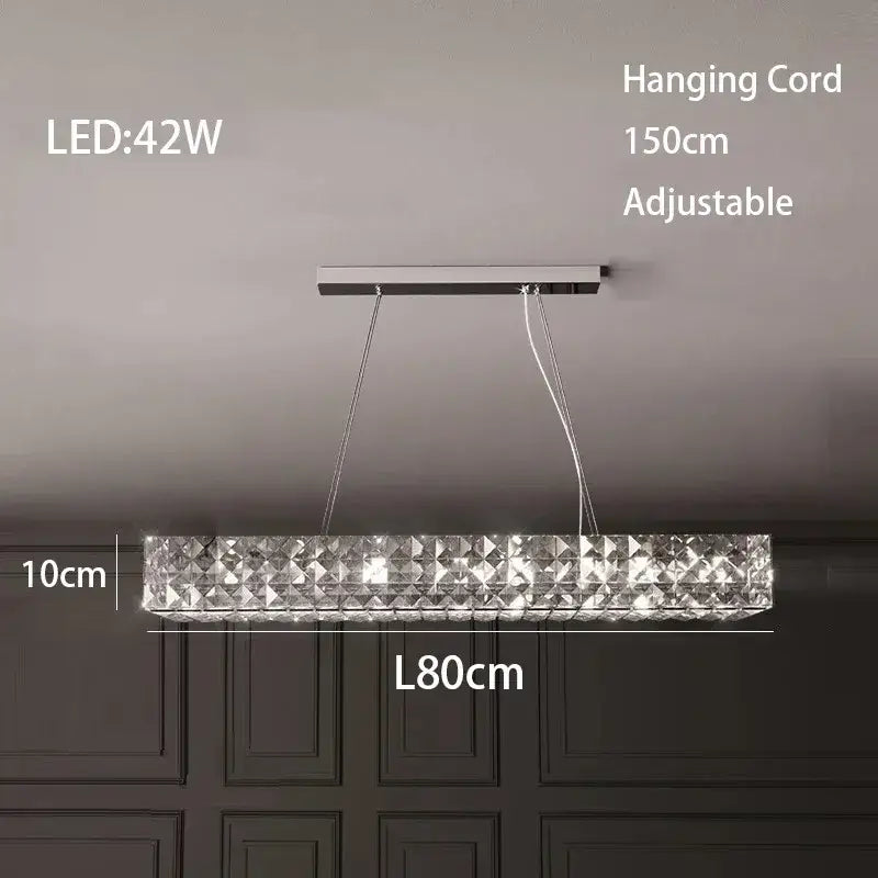 A sleek modern luxury chrome decorbites crystal led chandelier with clear crystal facets for dining room lighting