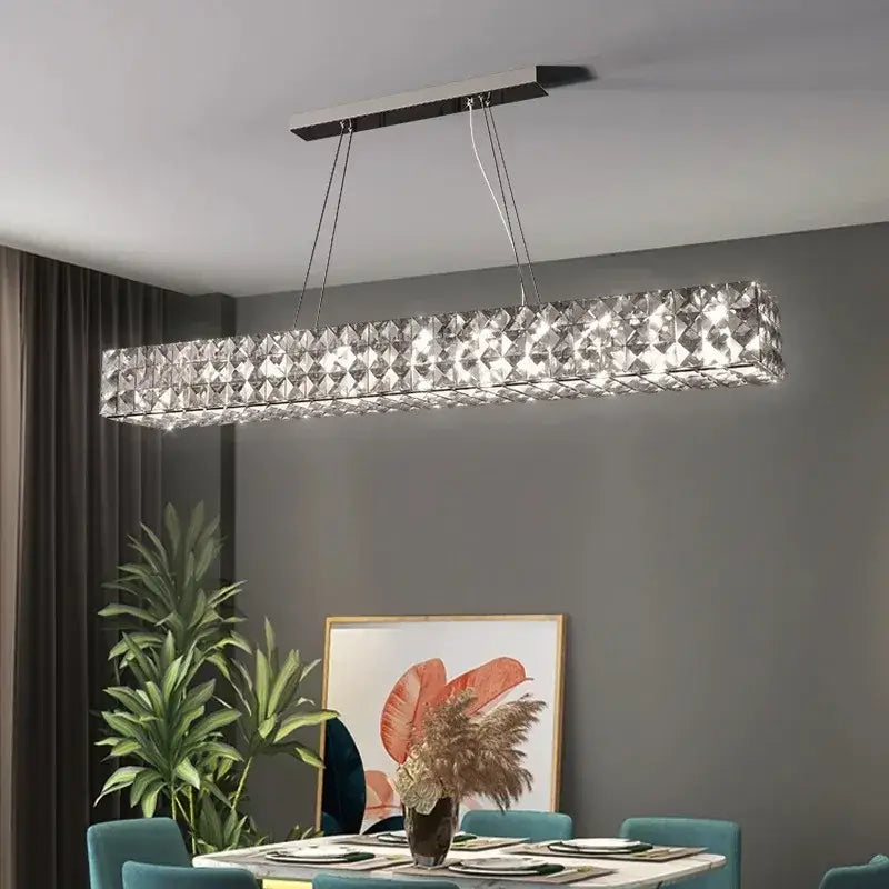 A sleek rectangular modern luxury chrome decorbites crystal led chandelier with metallic frame for dining room