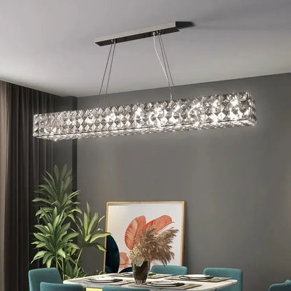 A sleek rectangular modern luxury chrome decorbites crystal led chandelier with metallic frame for dining room