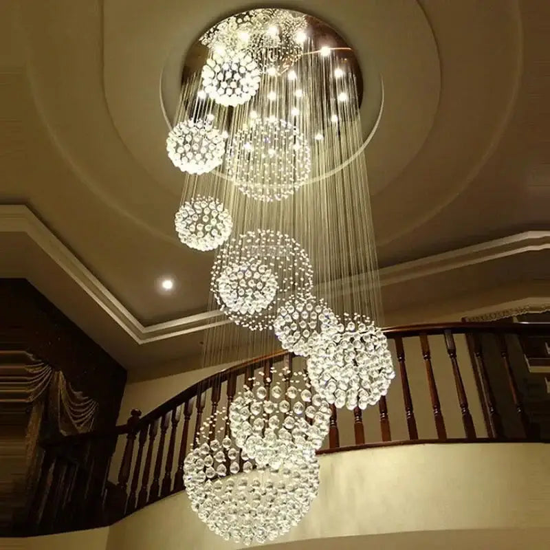 A modern luxury crystal ball led chandelier with clear faceted crystals and thin metallic rods for living room decorbites decor