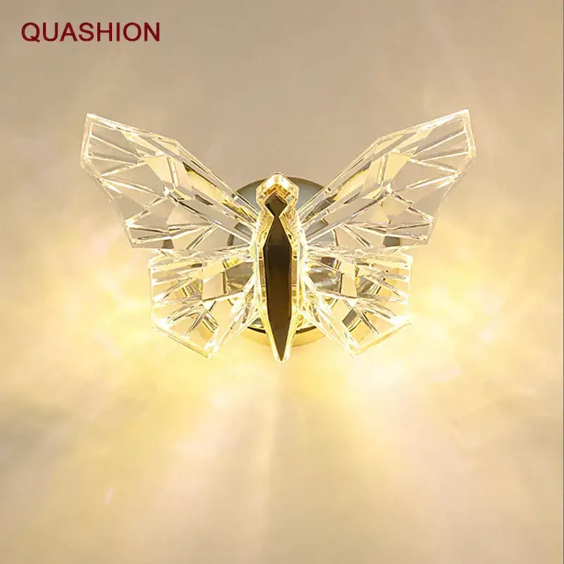 Modern luxury crystal butterfly wall lamp with gold-toned accents and faceted glass wings for bedroom decorbites decor