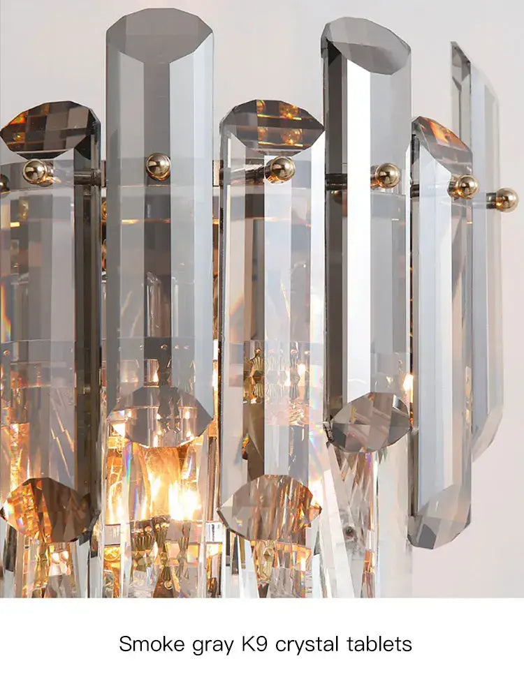 Modern luxury crystal gold led wall sconce with faceted smoke gray k9 crystal tablets and gold-toned decorbites crystal gold accents