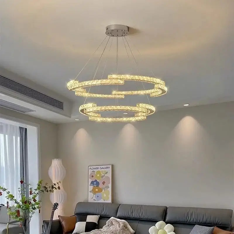 Modern luxury crystal led chandelier with multiple glowing clear crystal rings and sleek chrome mount for foyer decorbites crystal led
