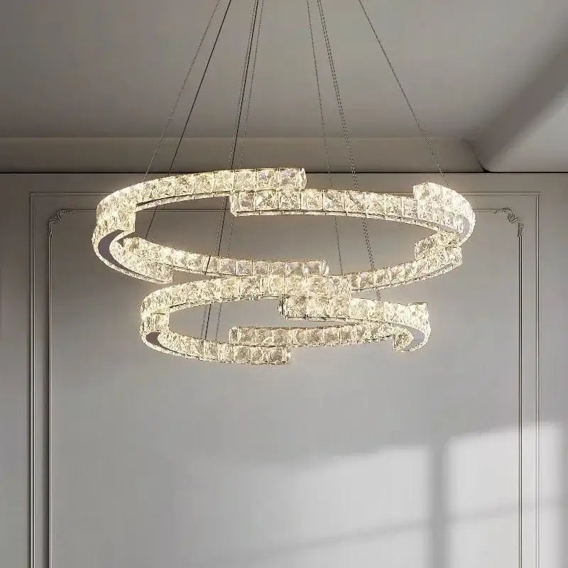 Modern luxury crystal led chandelier with interlocking clear faceted crystals in a sleek metallic frame for foyer decorbites crystal led
