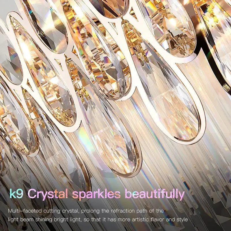 Modern luxury crystal led chandelier with gold-toned metal and cascading teardrop k9 crystals by decorbites crystal led