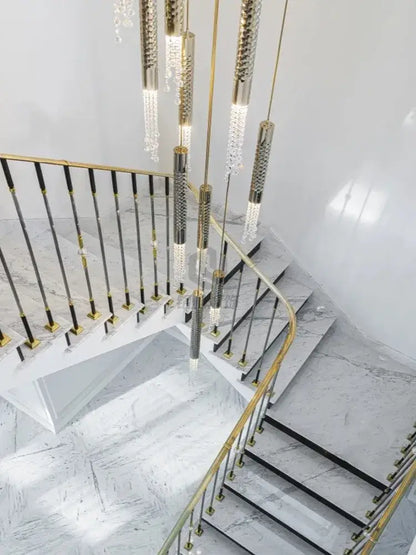 Gold-toned modern luxury crystal led staircase chandelier with cascading pendants and textured metallic rods for living room decorbites crystal led