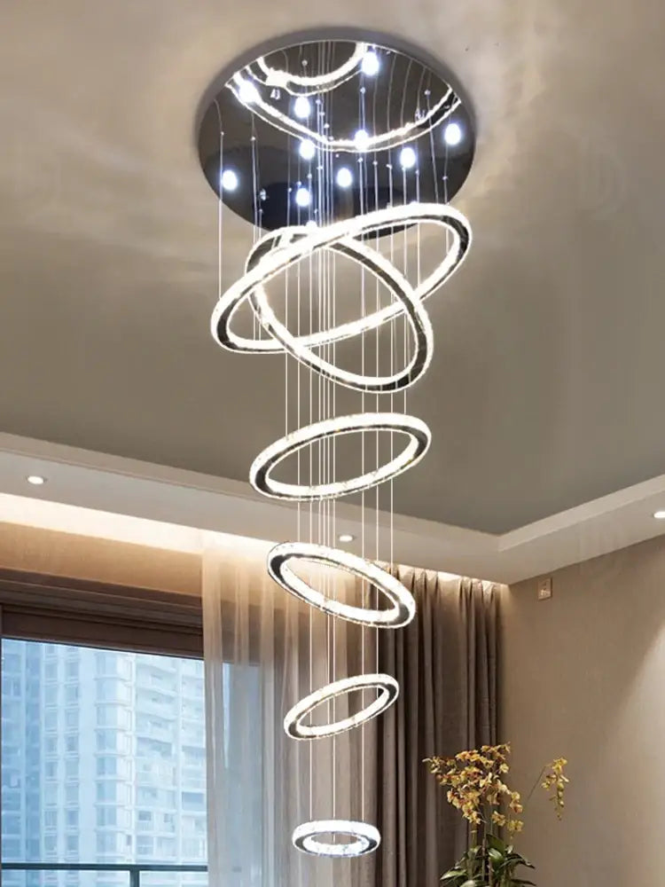 Modern luxury crystal rings chandelier with glowing circular rings and black mount, ideal for staircase lighting decorbites crystal rings