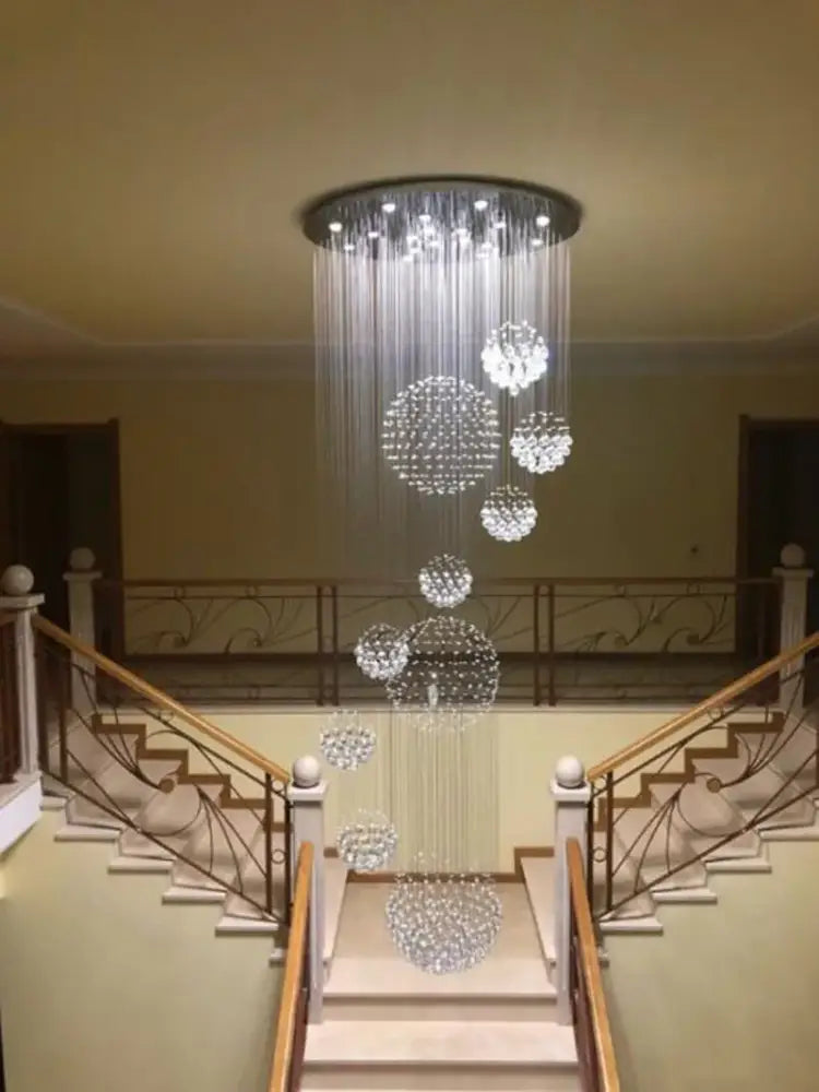 Modern luxury crystal staircase chandelier with cascading spherical clusters as a living room pendant light decorbites crystal staircase
