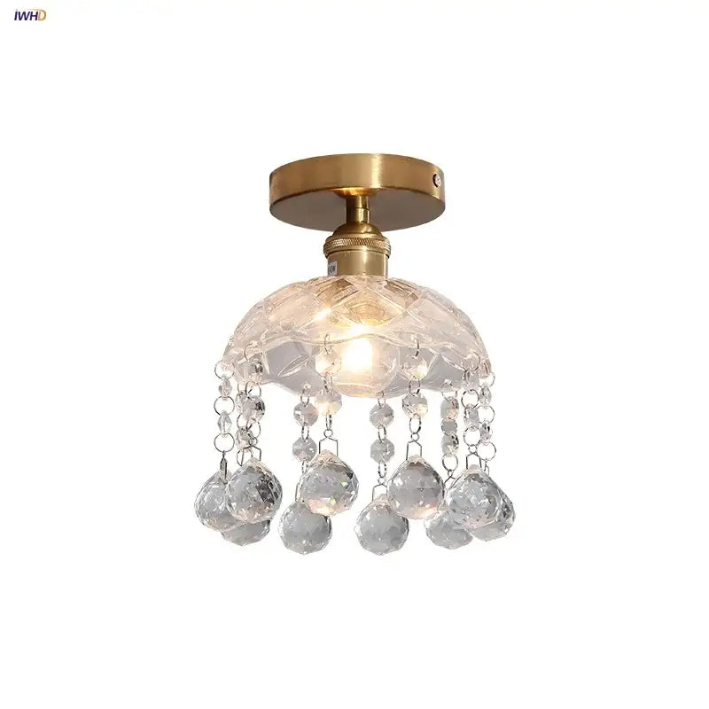 A modern luxury decorbites crystal glass ceiling lamp with brass finish and faceted spherical crystals for living room