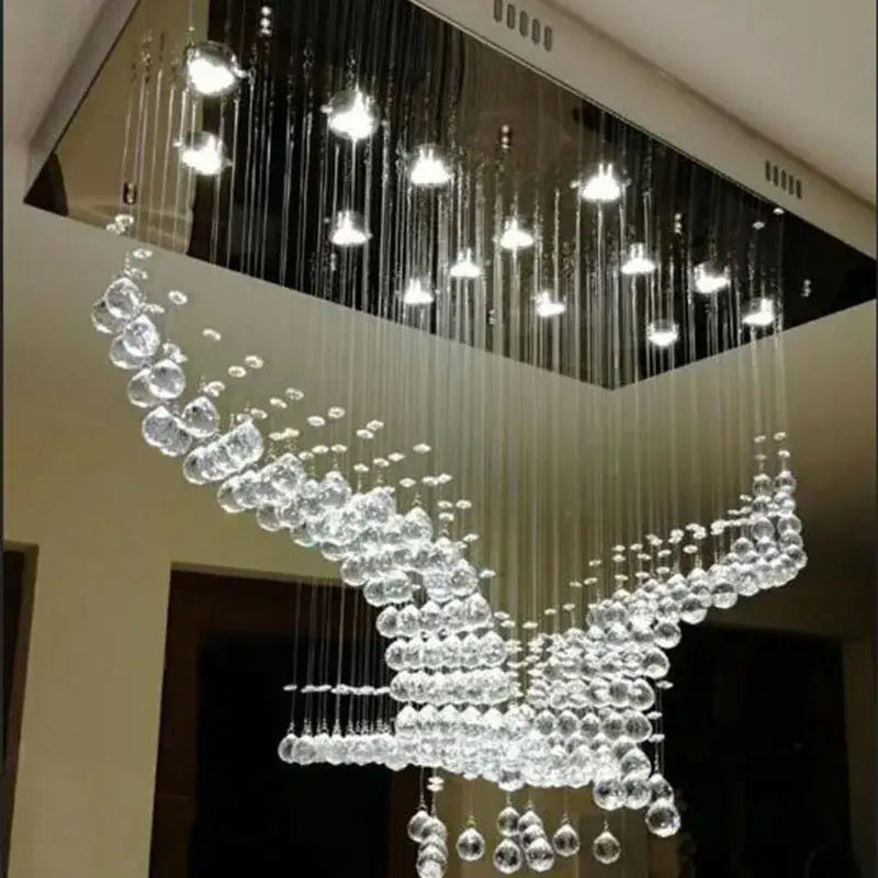 A modern luxury eagles crystal chandelier with cascading clear glass spheres for living room lighting