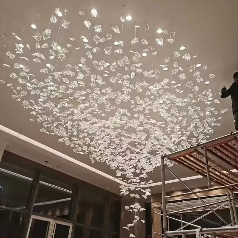 Modern luxury glass high ceiling led chandelier with clear crystal leaf pieces for living room decorbites glass high design