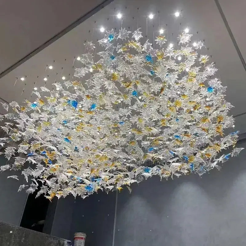 Modern luxury glass high ceiling led chandelier with translucent clear gold and blue glass leaves for living room decorbites glass high