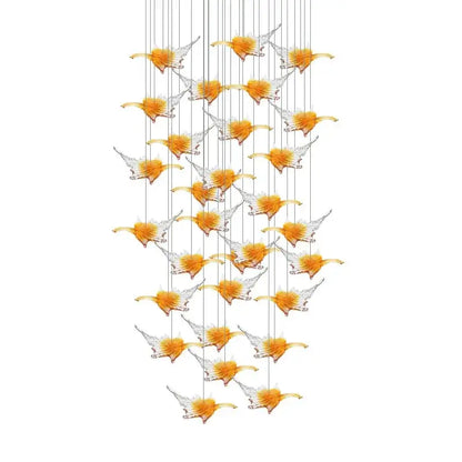 A modern luxury glass high ceiling led chandelier with translucent orange and clear bird-shaped pendants decorbites glass high