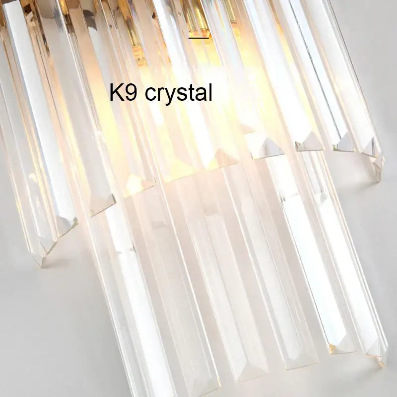 Modern luxury gold crystal led wall lamp with clear k9 crystal prisms for elegant bedroom decorbites crystal led decor