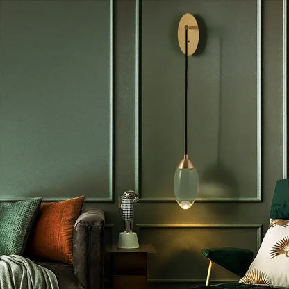 Modern luxury gold crystal led wall light featuring a brass metal fixture and oval glass shade for elegant decorbites crystal led wall decor