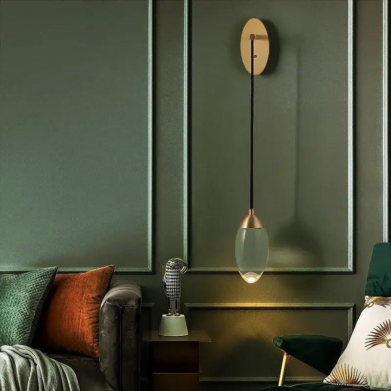 Modern luxury gold crystal led wall light featuring a brass metal fixture and oval glass shade for elegant decorbites crystal led wall decor