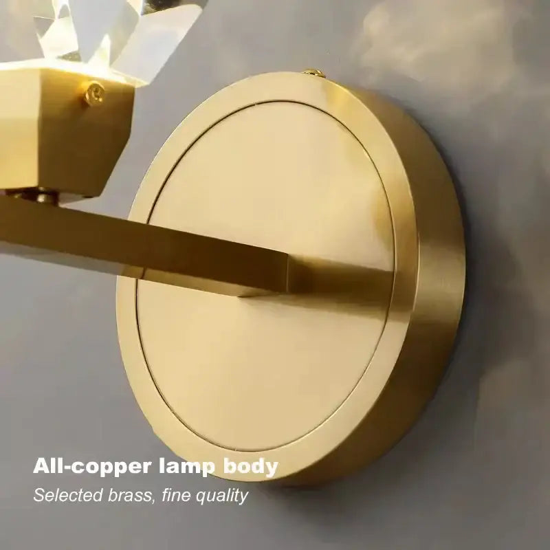 Gold-toned modern luxury wall sconce with polished brass finish and crystal led copper lamp body by decorbites