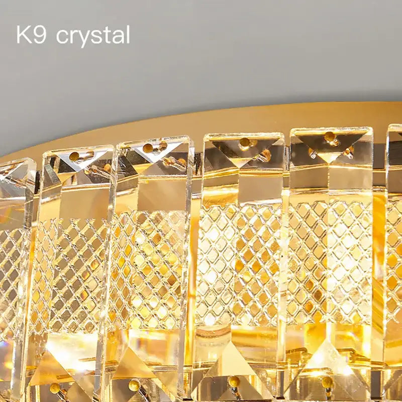 Modern luxury gold crystal round ceiling lamp with faceted rectangular panels and diamond-cut decorbites crystal round design