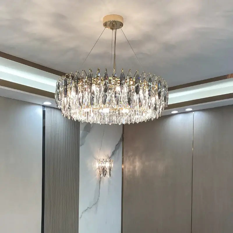 Modern luxury gold decorbites crystal atmosphere chandelier with multiple tiers of clear faceted droplets for dining room