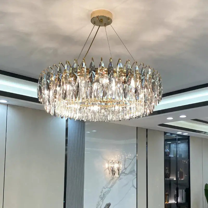 A modern luxury gold decorbites crystal atmosphere chandelier with clear crystal droplets for dining room lighting