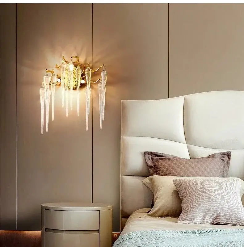 Gold-toned wall sconce with crystal water drop icicle elements for modern luxury decorbites crystal water lighting