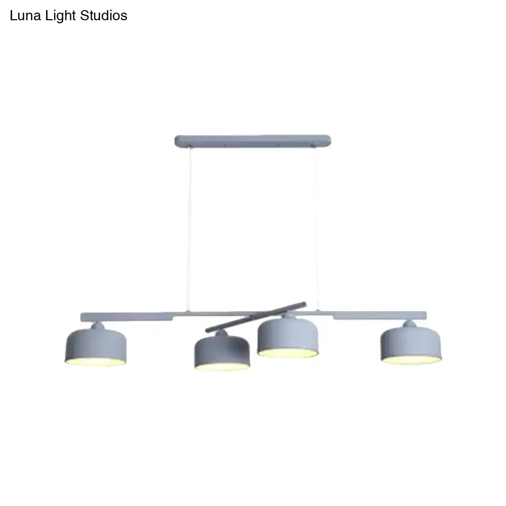 DecorBites™ modern gray metal pendant light fixture with three cylindrical shades and adjustable chain cord length