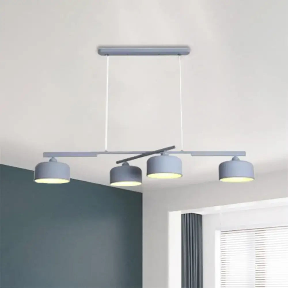 DecorBites™ modern gray metal pendant light with three cylindrical shades and adjustable chain cord length for dining table