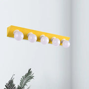Modern macaron pink and yellow vanity sconce with five spherical frosted bulbs for bathroom lighting