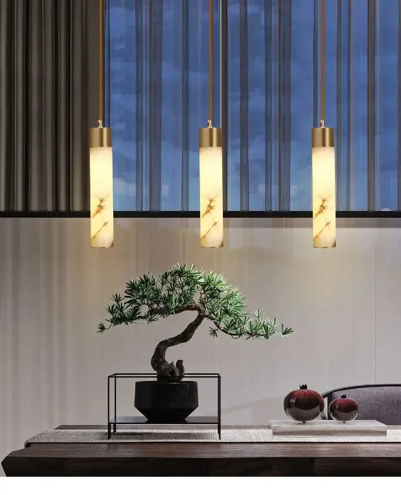 Three elegant gold-toned modern marble and copper led pendant lights with warm translucent shades for bedroom decorbites copper led