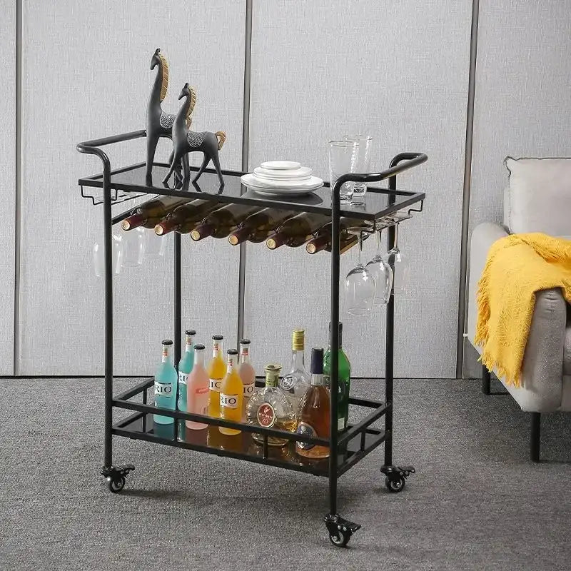 Black metal drinks trolley with glass shelves and wheels featuring decorative horse figurines and stocked bottles by decorbites drinks trolley