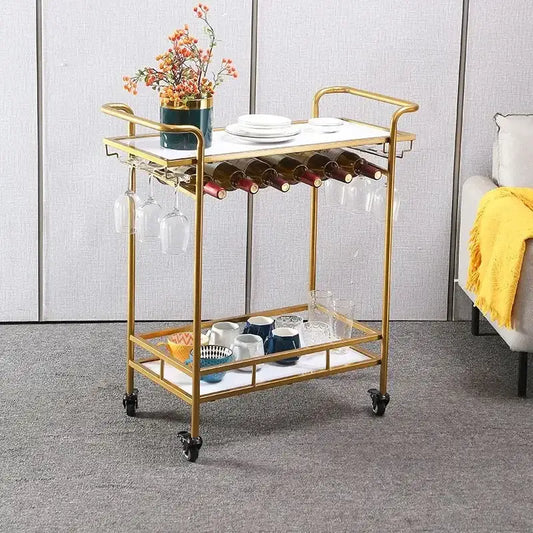 Modern marble and gold drinks trolley with white marble top, glass shelves, wine holders, and decorbites drinks trolley design