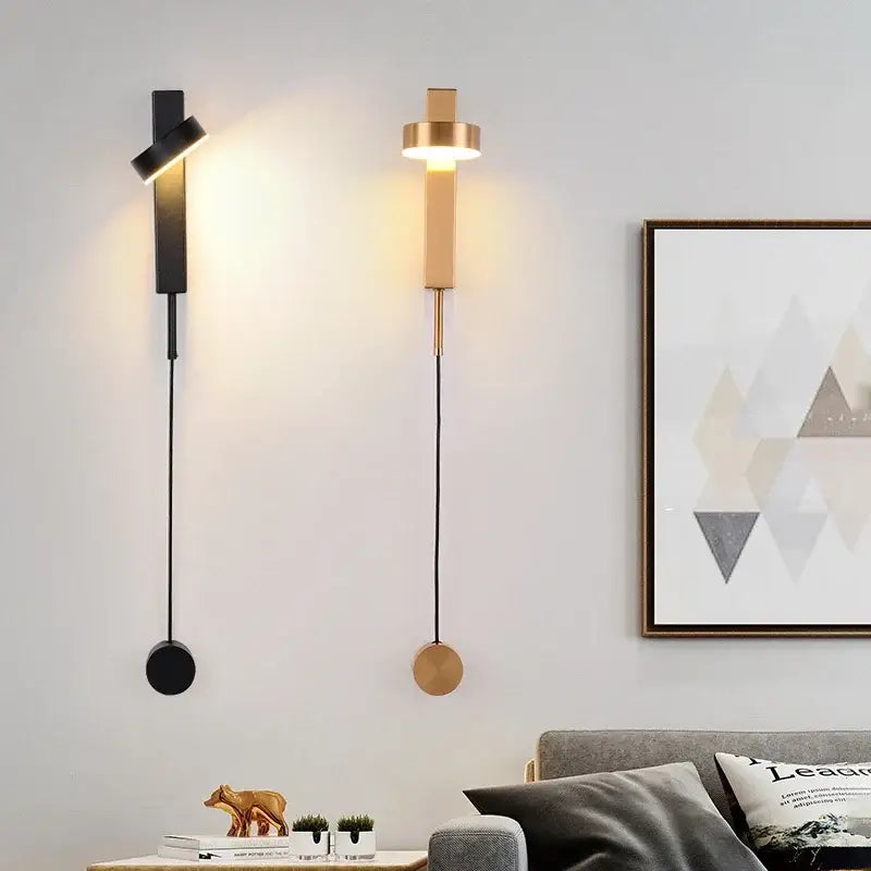 Two modern wall lamps with black rotating led and brass-toned minimalist geometric design for bedroom decorbites