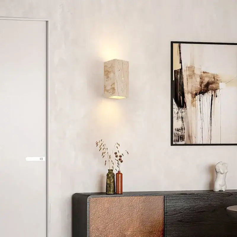 Beige marble-textured modern cuboid stone led wall lamp from decorbites with warm soft glow bedroom sconce set