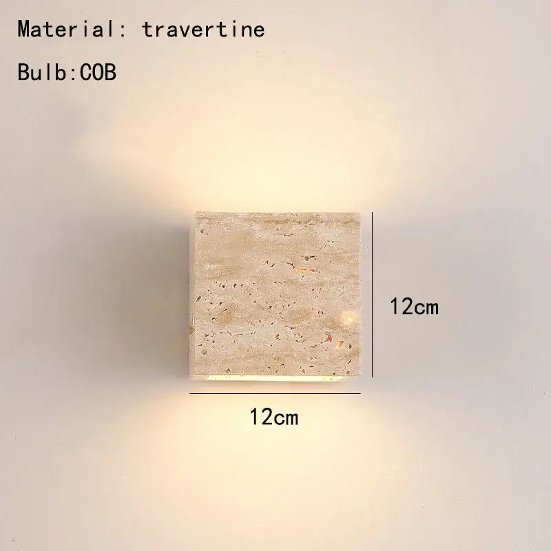 Modern marble cuboid stone led wall lamp with square travertine sconce and warm ambient glow by decorbites cuboid stone