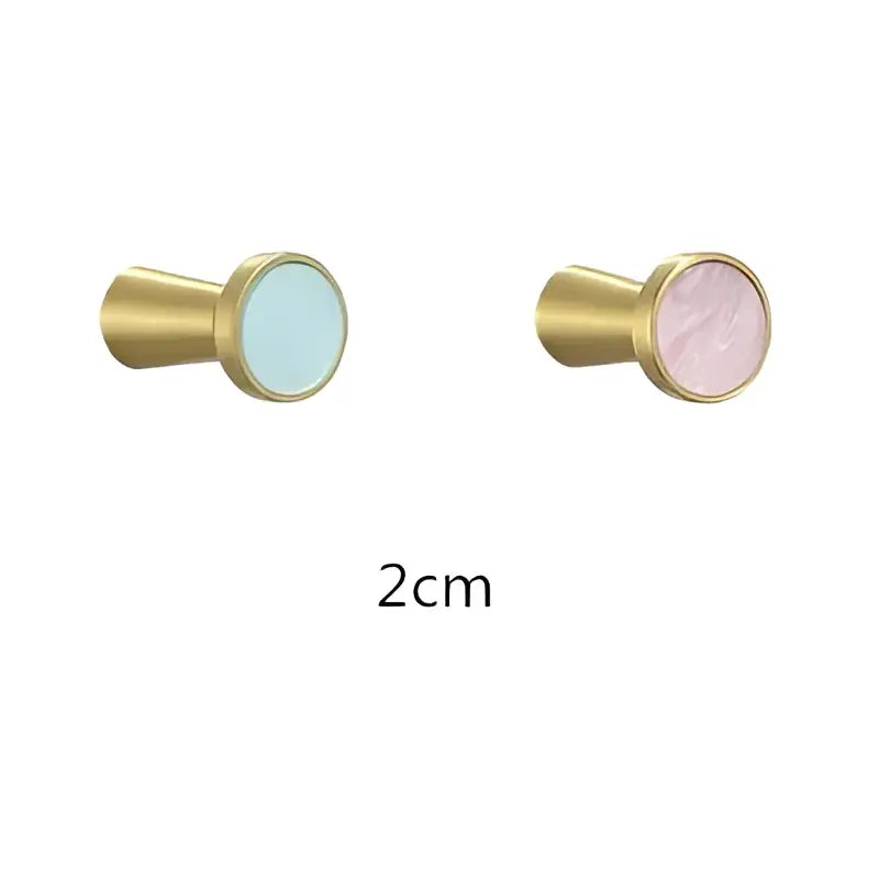 Gold-toned cabinet knobs with smooth blue and pink inserts 2cm diameter complement decorbites brushed gold towel hook bathroom decor